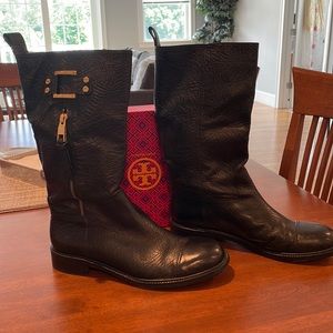 Tory Burch mid calf black boots with gold accents.